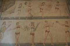 While excavating in 1959-60, it was  excavated a mosaic on the floor of the room dubbed the "Chamber of the Ten Maidens" it appears in a mosaic artwork which scholars named Coronation of the Winner. The young women perform sports including weight-lifting, discus throwing, running, and ball-games. A woman in a toga offers a crown and victor's palm frond to "the winner".