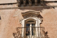 After the earthquake of 1693 when everything was destroyed in many areas of Sicily a new form of decoration was born.  Baroque Stone Carvings of heads under balconies supported by corbels of plaster  and stone.