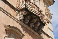 Balconies  became the emblem of the baroque decoration of many of these buildings.  In particular, facade balconies, supported by corbels made out of successive courses of stonework, or by large wooden or stone brackets, were ornate with facial masks.