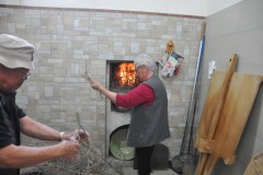 You can see the roaring fire in the oven in the home ready for baking the bread we made.