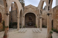 Interios with no roof and sand floors of the Church of John the Baptist.