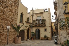 The building, to the immediate right of the facade of the church, overlooking the square, is the house where the Syracuse painter Mario Minniti, a friend and follower of Caravaggio lived.  Minniti was a fellow student and housemate of Michelangelo da Caravaggio (until 1600), at a time during which both were young painters seeking their fortunes in Rome.