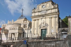 In the town of Piano d'Api, firefighters removed cracked stucco from the bell tower of the damaged Santa Maria della Misericordia church