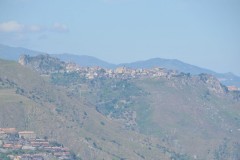 Nearby small village built along the top of the local hills.