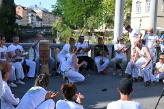 A group having fun, playing musical instruments and dancing to the beat of the music. 