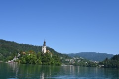 The lake surrounds Bled Island. The island has several buildings, the main one being the pilgrimage church dedicated to the Assumption of Mary, built in its current form near the end of the 17th century. It is decorated with remains of Gothic frescos from around 1470 in the interior, and with rich Baroque furnishing.