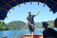 Riding in a Plenta.  Modern boats are still made by hand and are recognizable by their colorful awnings. Pletna oarsman employ the standing rowing technique to propel and navigate boats across the lake using two oars. The role of the oarsman dates back to 1740. The profession is still restricted. Many modern oarsmen descend directly from the original 22 families.