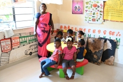 Young children with their teacher
