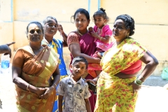 Neighbors come to meet the visitors and watch the ceremony to chase any demons from a person