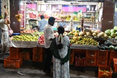 A couple buying fresh fruit