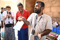 Pon our guide in India is explaining the Lotus Flower to us.