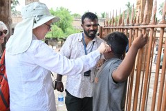 A young boy listening through the ear plug we all have when our guide is speaking.  The first time he has ever seen or heard of this. He admitted that he was playing hooke from school for the day.