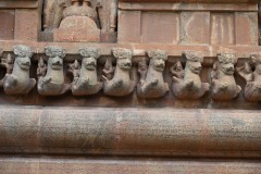 On each side are carvings on the wall with four horizontal rows of friezes. 