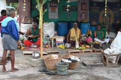 Hindi Priests waiting for people to secure their services for possible a memorial or funeral. 