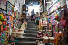 The lively interactions with vendors and fellow shoppers create a warm, inviting atmosphere that captures the essence of Madurai