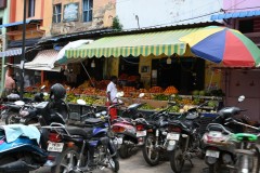 Motorcycle parking and fresh fruits for sale in the market area