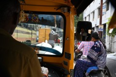 Passenger view from inside an "Auto"  3 wheel cart in traffic. 