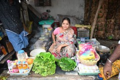 A lady selling a little bit of everything including the Betel for health benefits. 