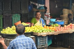 A vendor deep in conversation with a friend or a customer