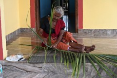 We have a demonstration of taking a palm leaf and preparing it for use braiding the palm leaf. 