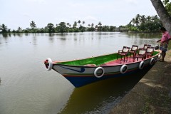 After our first stop we board small boats to use on the canal called Shikara boats.  We are about to explore some of the more narrow canals.  