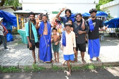 A group of young guys headed to a beach nearby for bathing and fun.