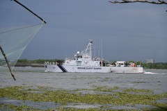 Indian Coast Guard ship headed out to the Arabian Sea a short distance where we are