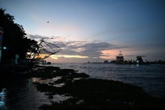 Sunset on the river and a final look west at the Arabian Sea harbor entrance