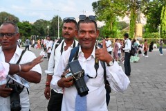 Everyone wants to take your photo for a price. He did take the group photo of us.  