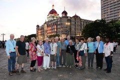 A photo of our group at the Gateway to India Plaza with the Taj Mahal Palace Hotel in the background. 
