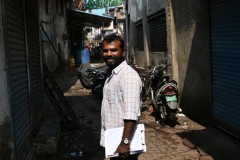 Dennis looking back to see if I am lost again.  I kept stopping and talking to kids, shop keepers, locals. 