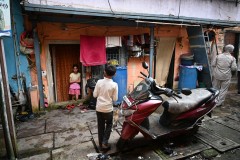 The young girl standing down in the door way is the entrance to the small home we visited.  