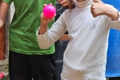Kids happy to have a photo taken of themselves. 