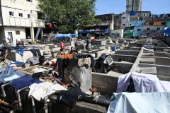 There are rows of open-air concrete wash pens, each fitted with its own flogging stone. Claimed to be the world's largest outdoor laundry,