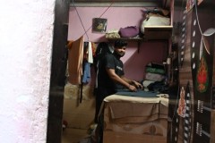 We find a young man ironing all day long.