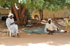 Friendly locals outside the Mahdi's tomb building