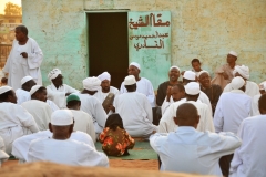 Men praying at the local outdoor mosque.