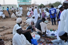 Just outside the circle where the Whirling Dervishes are participating is a small market or souk