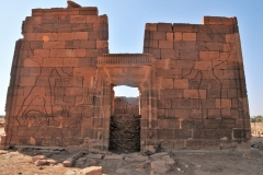 Apedemak was a lion-headed warrior god worshiped in Nubia. The god was used as a sacred guardian of the deceased hereditary chief, prince or king. Anyone who touched the chief's grave was said to be cursed by this Apedemak.The relief on the right pylon of the Apedemak Temple depicting Queen Amanitore smiting her enemies