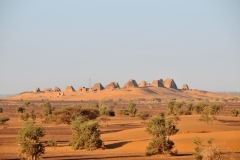 First light in the morning seeing the The Royal Necropolis of Meroe from a distance from our overnight camp. It is located 4 miles from the Nile on some hills covered by yellow sand dunes.