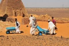 Workers working to restore another pyramid