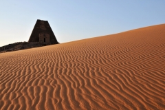 One of my favorite photos of the trip with the wind in the sand and the sun setting.