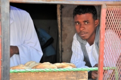 We stopped to buy some of the delicious bread made daily. Young boy checking out the strangers,, us.