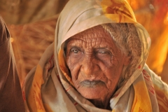 The toll of living in this forboding land is shown in the lines on her face.