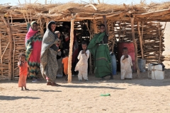 We are so lucky to live where we do in the western world. These families live with the winds blowing constatnly from sand dunes. The heat is oppressive. They travel miles on foot with donkeys to obtain water from wells that are 200 feet deep. Who knows where they obtain their food to eat. There are no bathrooms as we know it. Yet they are happy. When we depart we leave fruit and food gifts for them for permitting us to stop for s short visit and photograph them. We are so lucky.