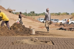 At the end of the river trip we came upon a group of men making mud bricks and drying them in the dirt