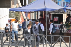 Students going home for lunch. All students male students must wear a white shirt and tie to school.