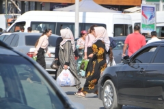 Ladies doing their daily shopping for the home. Notice the styles for the ladies.