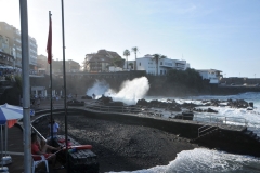 Life guards are seated to the left in the photo. I cannot understand why anyone would go out to the water in that location with rocks and heavy waves.