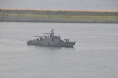 A naval ship is in the harbor having followed us into the harbor.  The last 4 or 5 nights we have been traveling in Pirate infested waters.  We run dark with all the window shades closed and limited outside lighting.  I am sure this is the reason for the escort into the port.